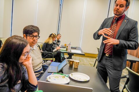 Students listen to presenter